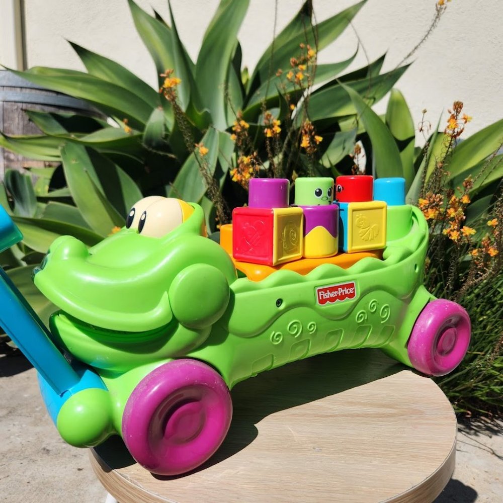 Fisher-Price Stack 'n Surprise Blocks Musical Crocodile Wagon Storage Ride-on